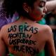 Protester at a pro-abortion demonstration in Buenos Aires. The text on her skin reads “Rich women abort, poor women die.”